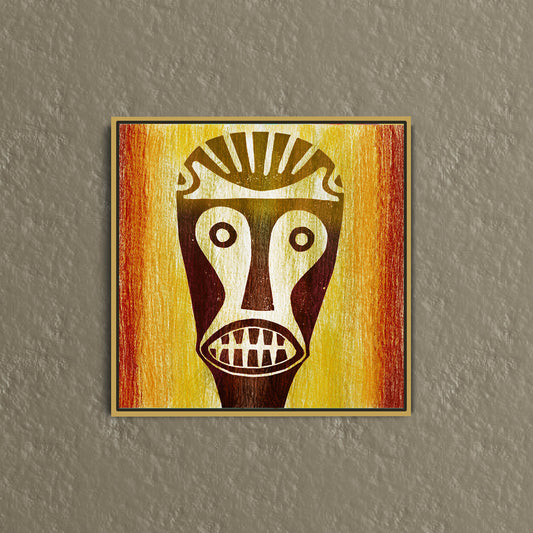 The framed canvas art piece Big Teeth Mask showcases an abstract African mask with stylized large eyes and bared teeth against a vibrant orange-yellow gradient,  hanging on a textured gray wall.