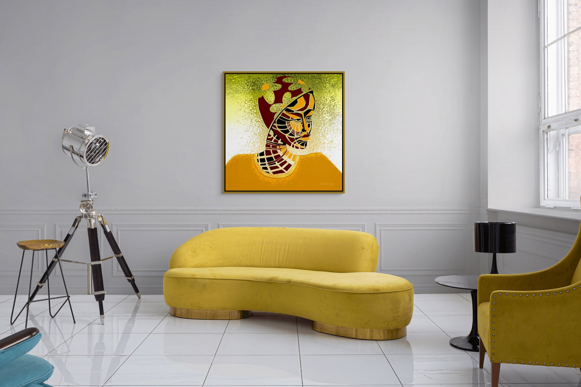 A modern living room with a yellow curved sofa on white tiles. Hanging above is the Elements Of Beauty - Contemporary African Minimalist Art Print with a gold floater frame. To the left is a silver tripod lamp, while to the right sits a black side table and a yellow arm chair.