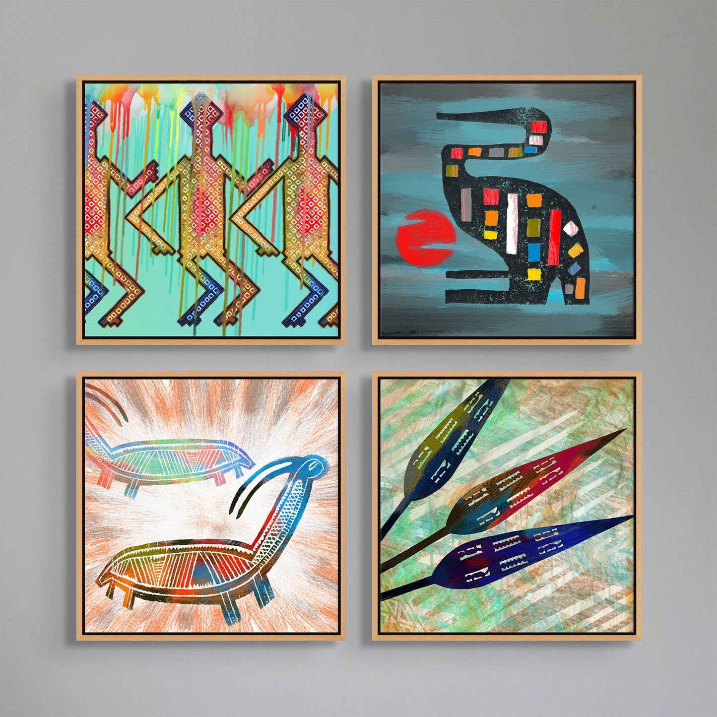 Four ready-to-hang Spearheads- Canvas Art pieces adorn the wall with vibrant geometric designs: turquoise humanoid figures, a colorful bird with a red sun, two reclining figures, and stylized floral shapes—each elegantly framed in light wood.