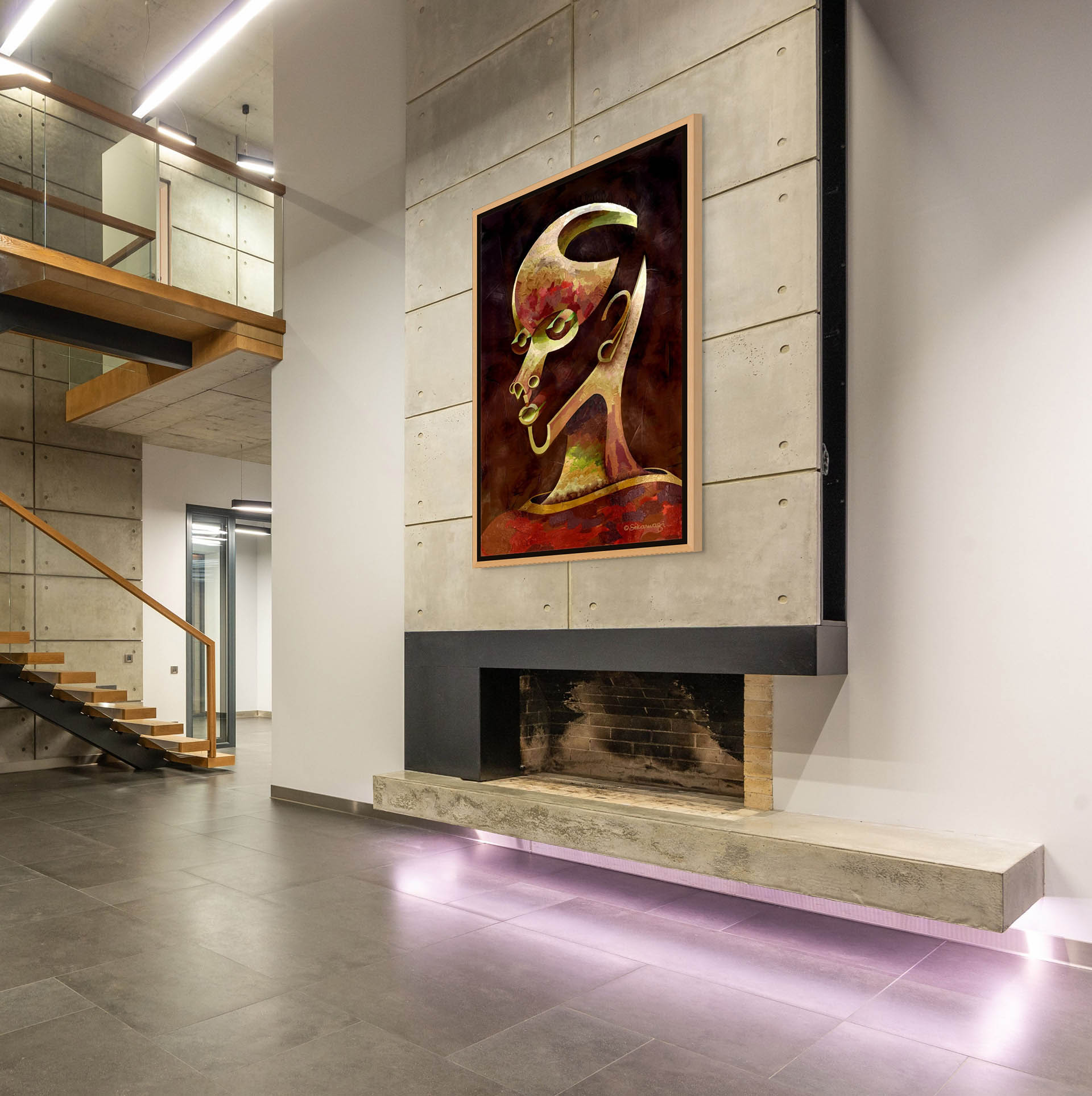 The modern industrial interior features concrete walls and floors. The "Is What You See What You Get?" canvas art, a bold abstract painting of a colorful face in gallery wrap style with a gold floater frame, hangs above the minimalist fireplace. Wooden stairs with metal railings lead to the upper floor.