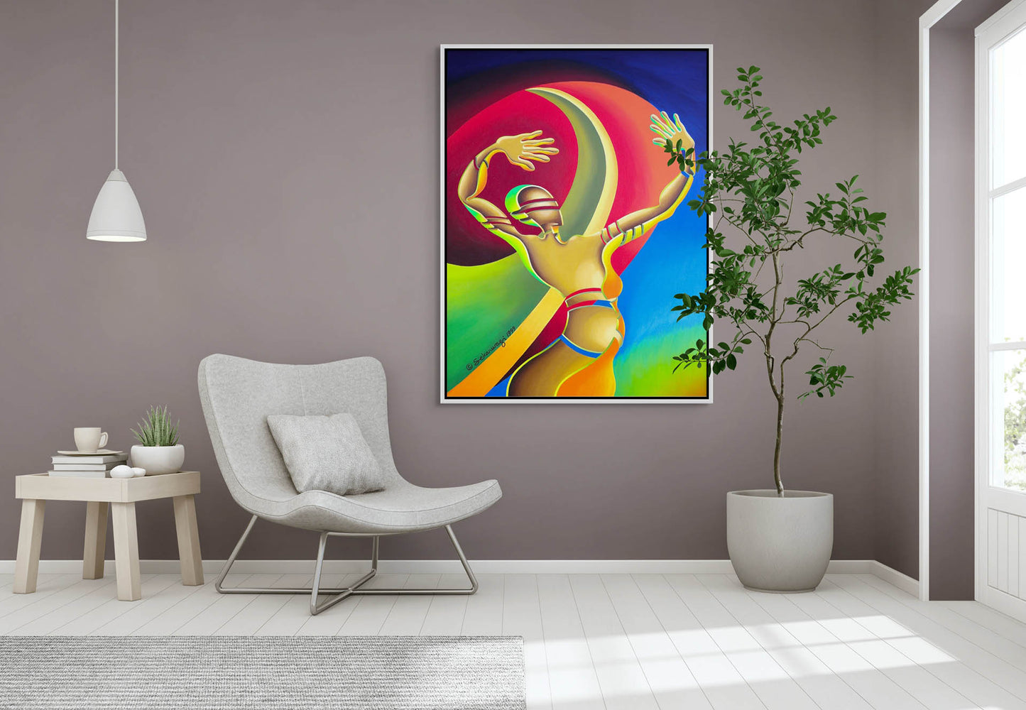 A modern living room features The Awakening - Canvas Art, a colorful abstract painting of a figure with raised arms against a gray wall. The decor includes a white chair, small side table, hanging lamp, and green potted plant for an elegant touch.