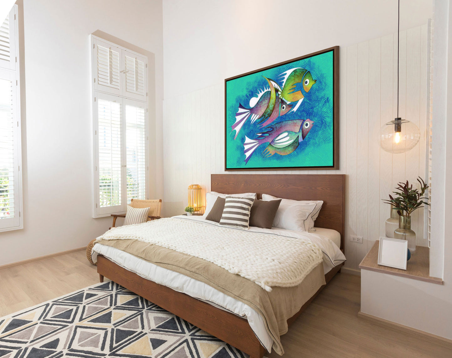 The lovely bedroom decor features a large bed with white and beige linens, a geometric rug on the floor, and "Aquarium #2" Canvas Art stretching above the headboard above. Light streams through tall windows with shutters, while a potted plant adds greenery nearby.