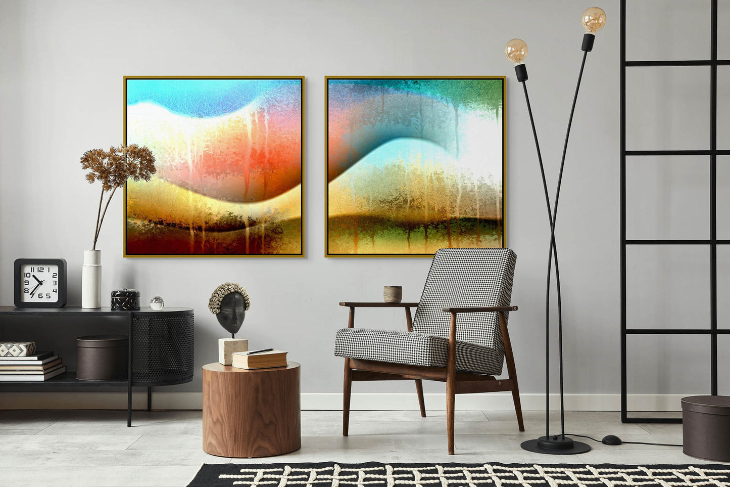 A modern living room features a mid-century armchair, wooden side table, and tall floor lamp. Two vibrant abstract paintings, including Awesomeness - Canvas Art, hang above a console table adorned with dried flowers and a sculpted head.