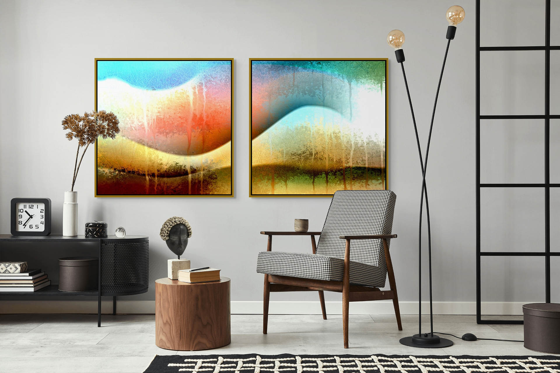 A modern living room features a mid-century armchair, wooden side table, and tall floor lamp. Two vibrant abstract paintings, including Awesomeness - Canvas Art, hang above a console table adorned with dried flowers and a sculpted head.