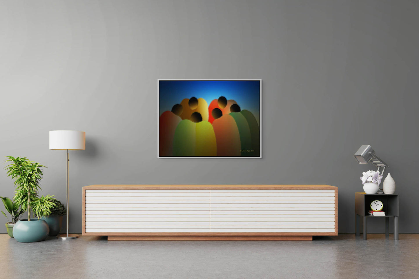 A minimalist living room features a gray wall with the Circle Of Friends canvas art in gallery wrap style. Below, a low wooden sideboard holds a lamp, books, and a clock, while a potted plant adds greenery. The ready-to-hang painting brings instant flair to the setting.