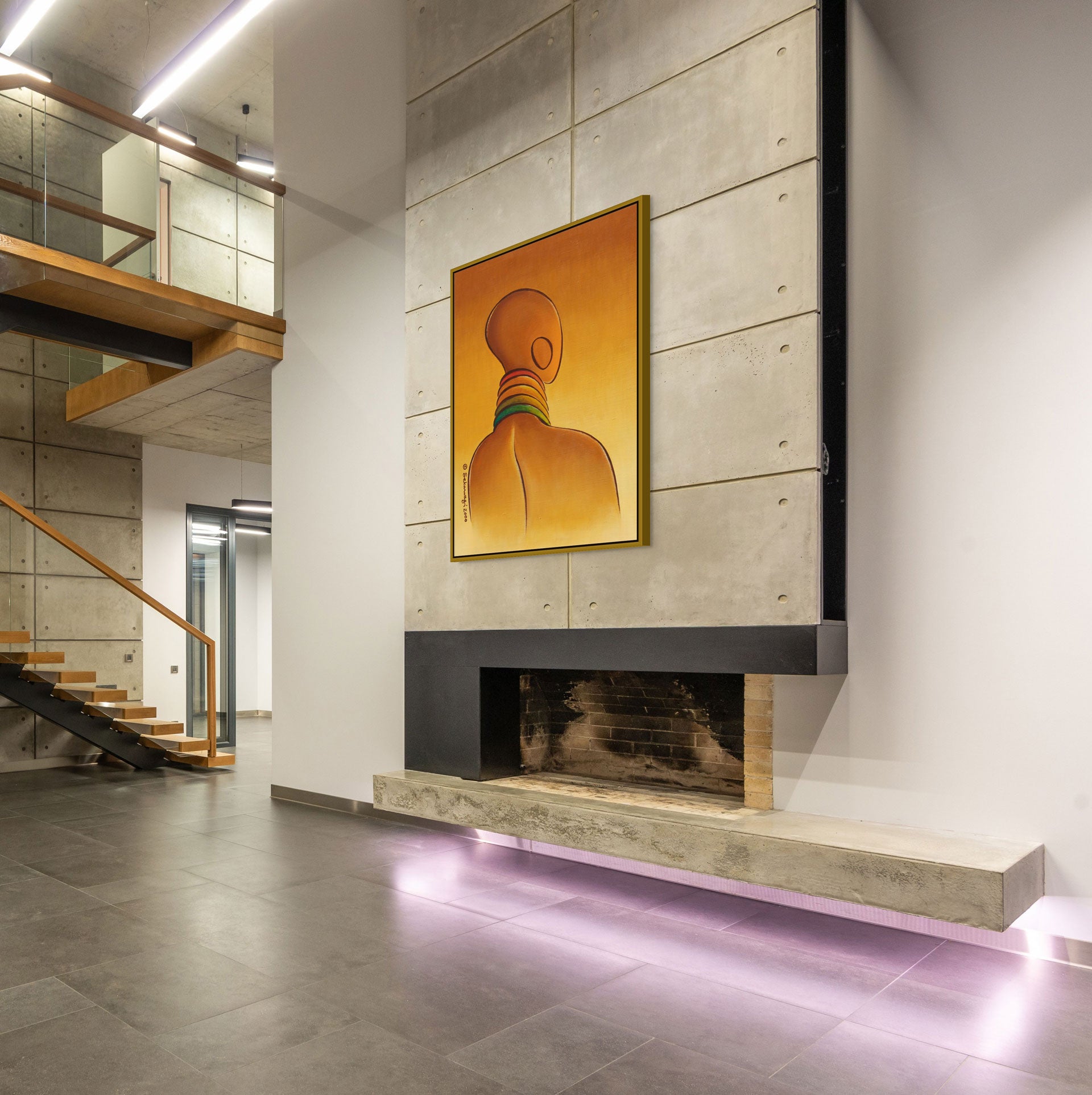 The modern interior with concrete walls and floors showcases the Elegance - Contemporary African Minimalist Canvas Art Print of a person with neck rings above a minimalist fireplace. Ready to hang, it beautifully complements the wooden staircase and glass railing in the background.