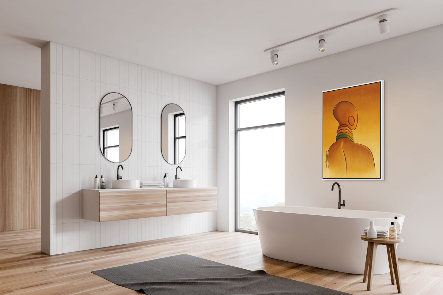 A minimalist bathroom with light wood flooring features a freestanding white bathtub, a small wooden stool, and a double sink with oval mirrors. Natural light pours through a large window, while the Elegance - Contemporary African Minimalist Canvas Art Print adorns the wall.