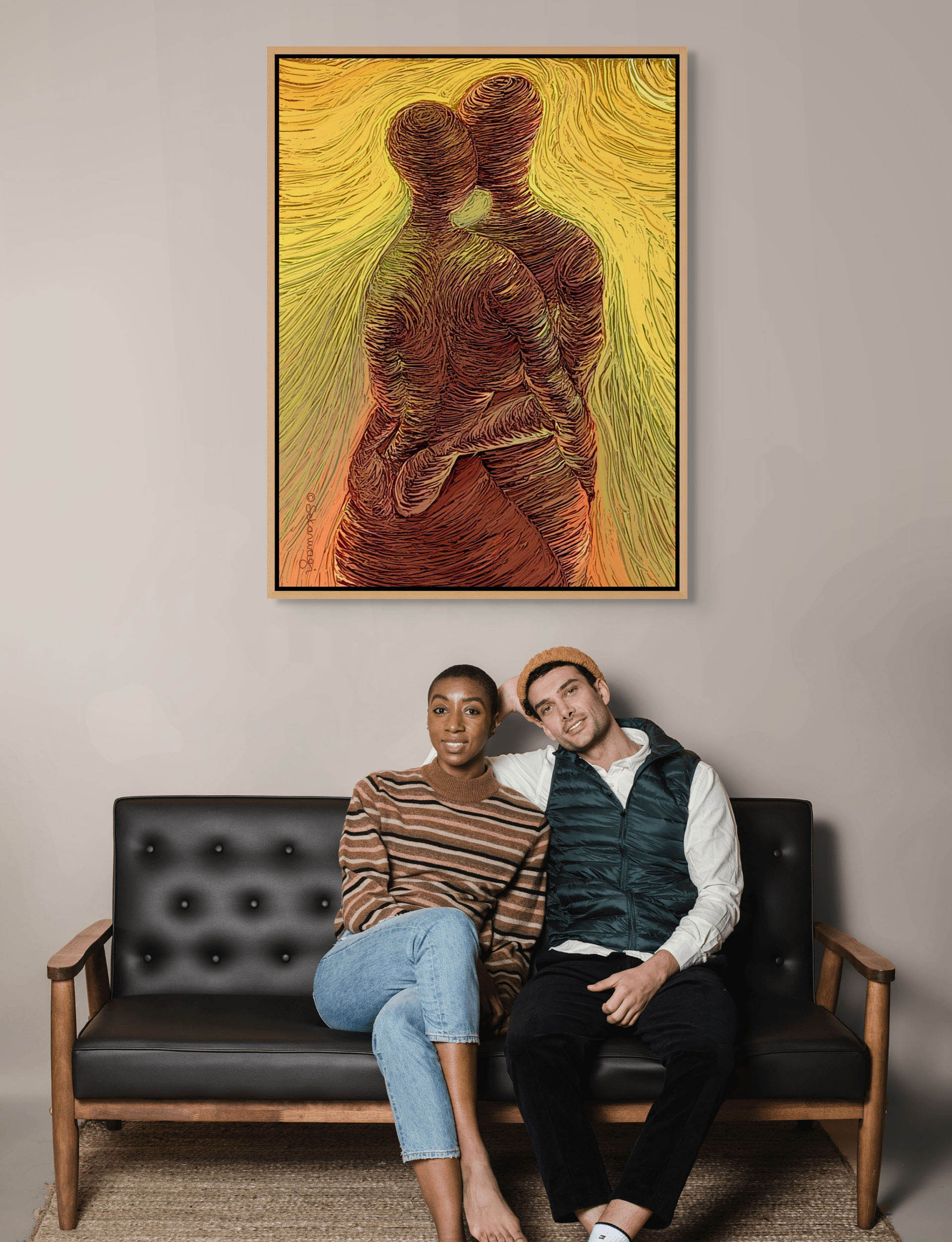 A woman and a man sit closely on a black sofa, the mans head resting on her shoulder as they look at the camera. Above them, the Loving Me, Loving You canvas art showcases premium quality cotton with abstract entwined figures in warm colors, elegantly hanging on the wall.