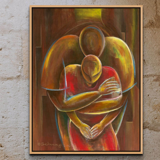 The Nurturing - Canvas Art features two abstract figures with warm colors embracing each other, blending into a unified form. Its ready to hang on a textured concrete wall and comes in a simple natural wood frame.