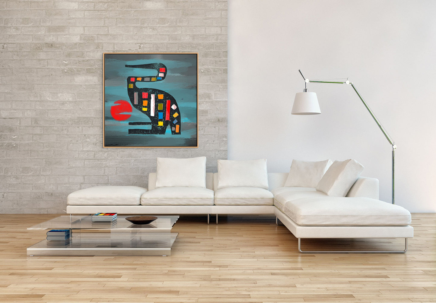 The minimalist living room features a white sectional sofa, glass coffee table, and floor lamp. The Seated Crane canvas art print with a bird and red circle adorns the light gray brick wall, adding vibrancy. With wooden flooring, the space maintains a modern, airy ambiance.