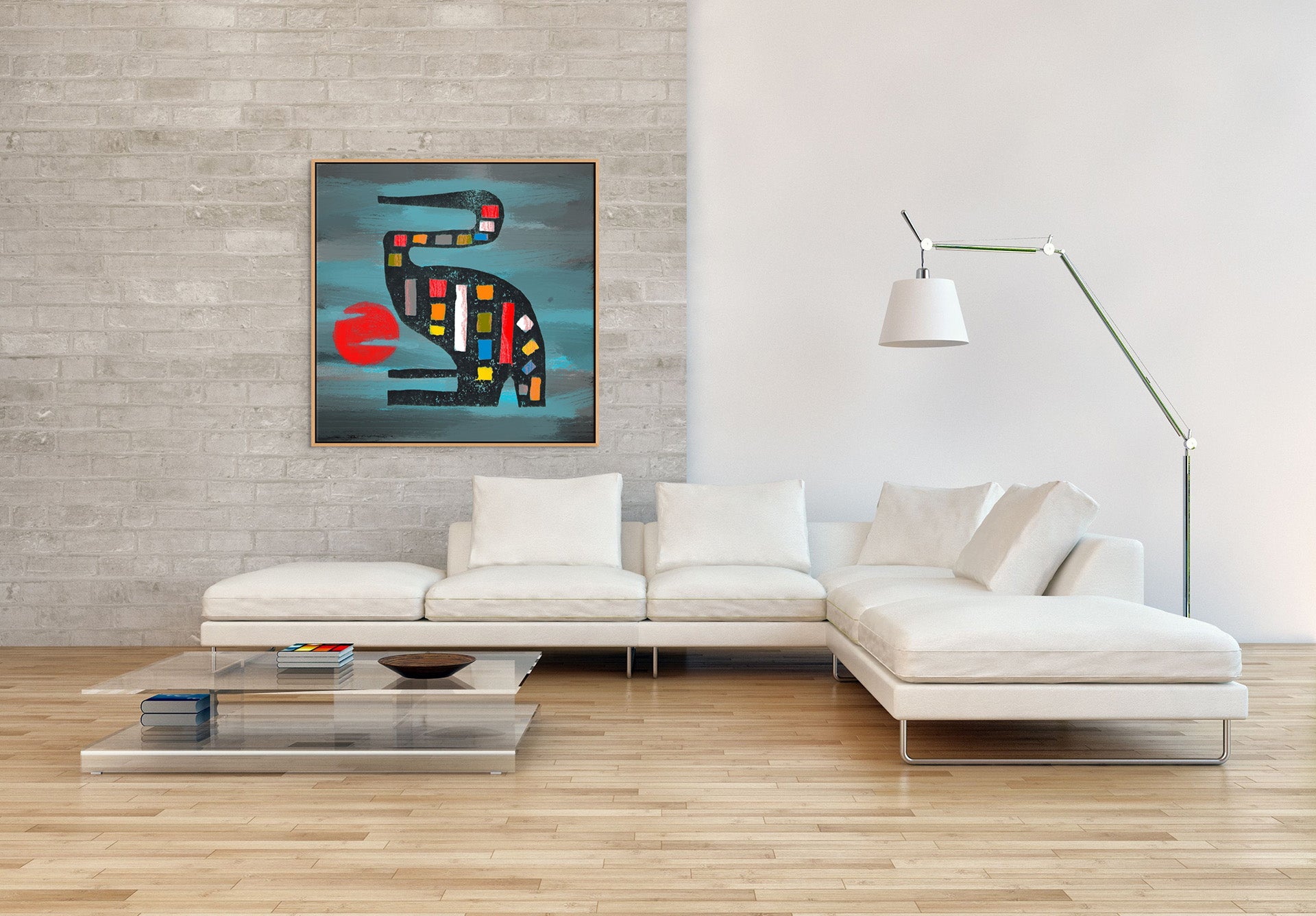 The minimalist living room features a white sectional sofa, glass coffee table, and floor lamp. The Seated Crane canvas art print with a bird and red circle adorns the light gray brick wall, adding vibrancy. With wooden flooring, the space maintains a modern, airy ambiance.