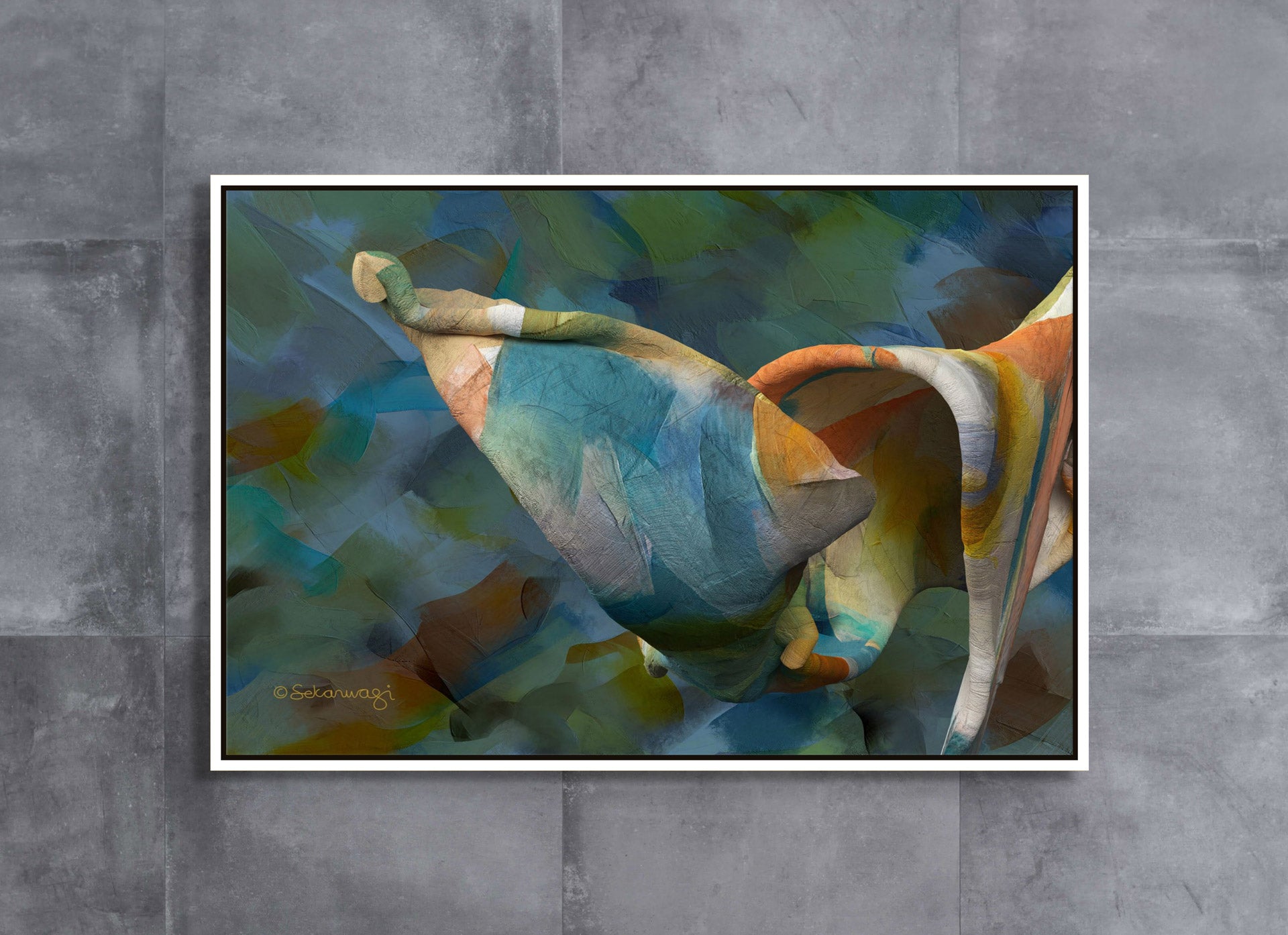 Art piece Unfolding Thought displays a swirl of blue, orange, and green on premium cotton canvas with a textured, fabric-like look. The framed image is set against a gray tiled wall.