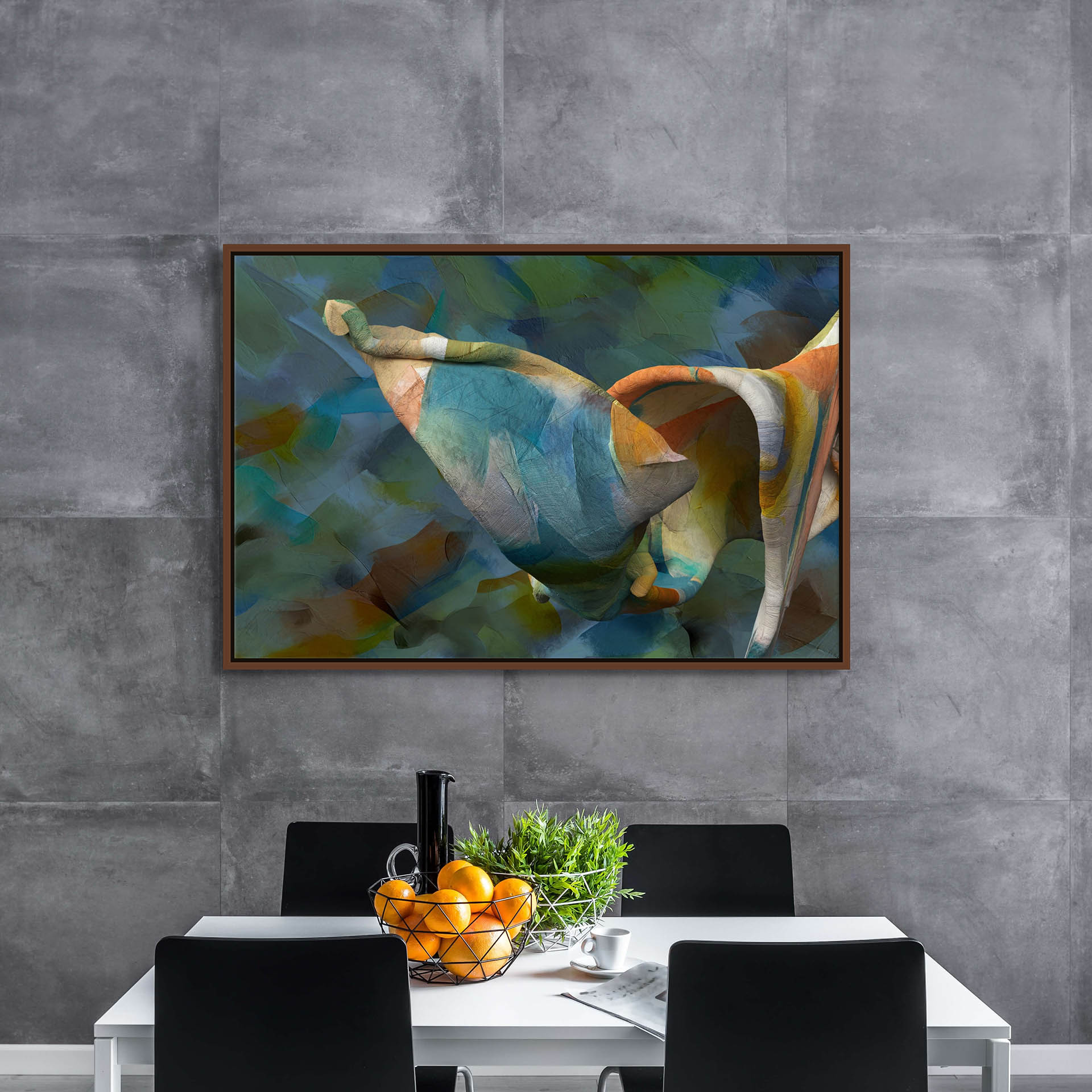 A modern dining area showcases a white table and black chairs, highlighted by a centerpiece of oranges and greenery. The gray textured wall is elegantly adorned with Unfolding Thought canvas art, featuring colorful abstract patterns reminiscent of giclee prints.