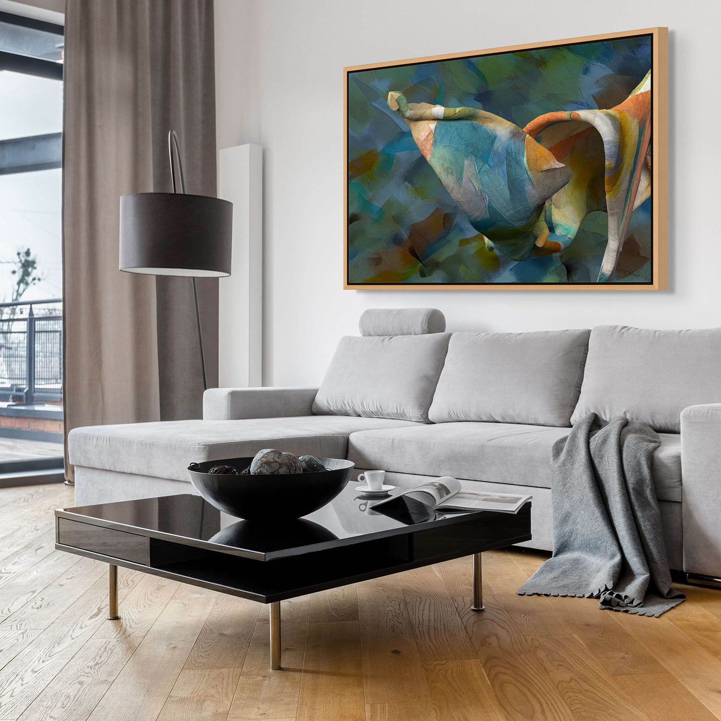 A modern living room showcases a gray sofa and black coffee table beneath Unfolding Thought on premium cotton canvas. Large windows with sheer curtains let natural light illuminate the wooden floor, decor, and artful ambiance created by giclee prints.