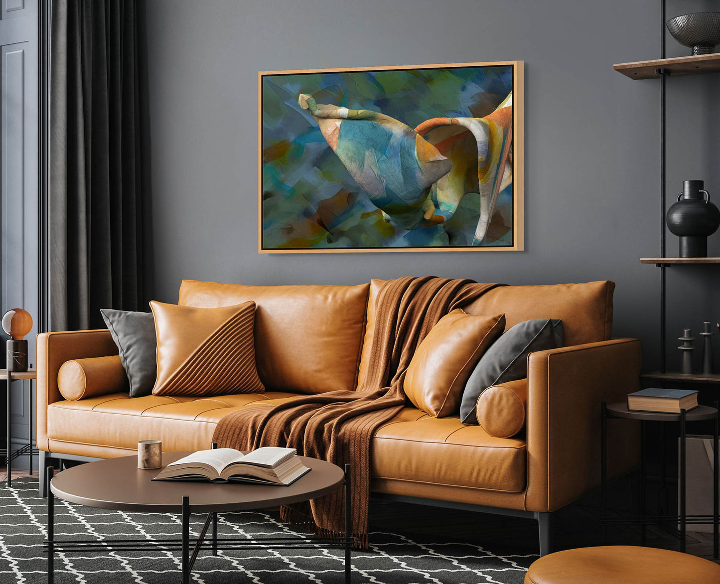 A modern living room showcases a tan leather sofa adorned with gray and brown cushions and a matching throw. The Unfolding Thought canvas art print hangs above. A round coffee table with an open book sits on a geometric-patterned rug, while nearby shelves display decorative items.