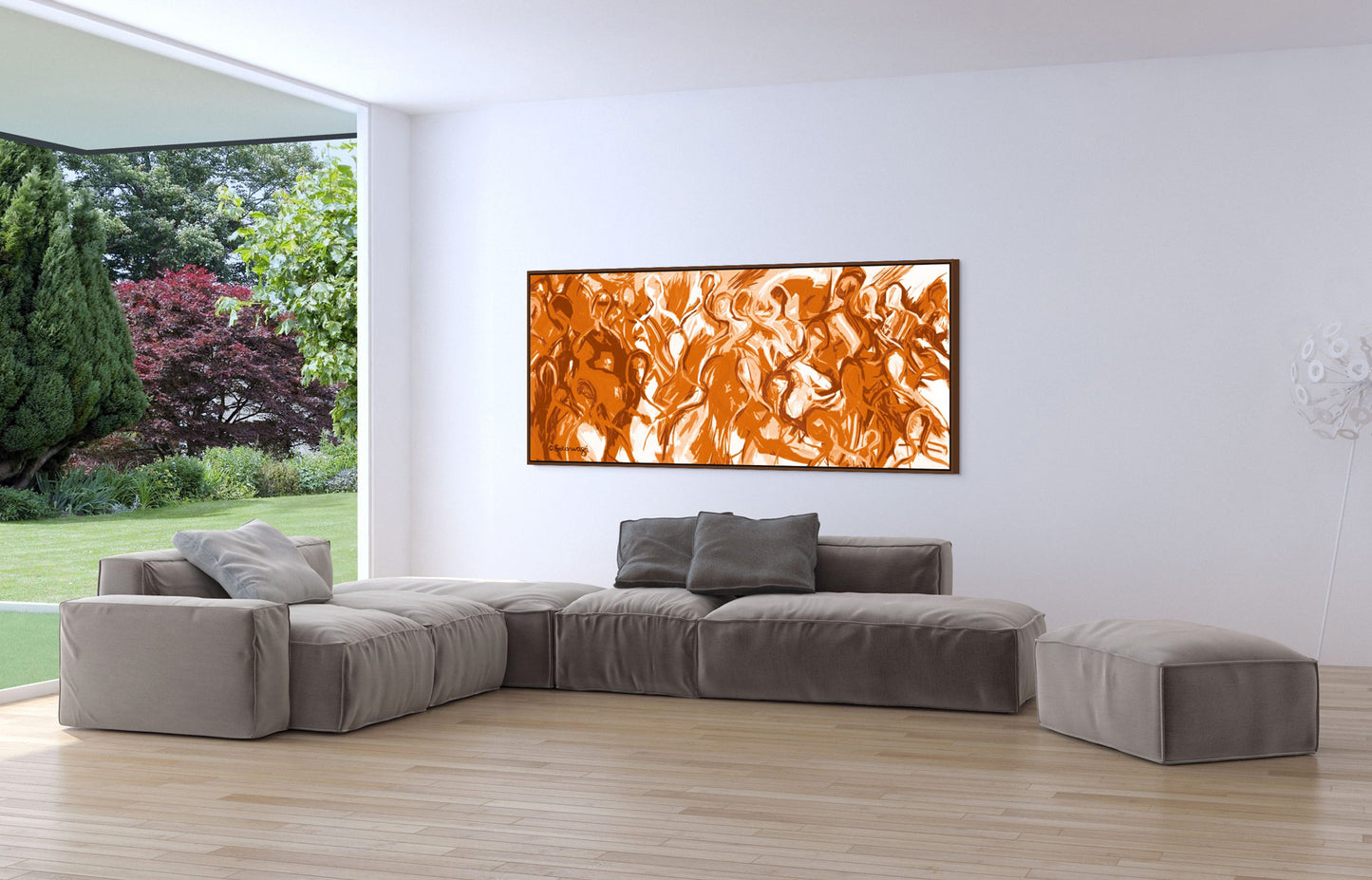 A modern living room showcases a large beige sectional on wood flooring, accented by the We Are All Connected canvas. This vibrant orange painting enhances the white wall, while huge windows reveal a lush garden of trees and shrubs outside.