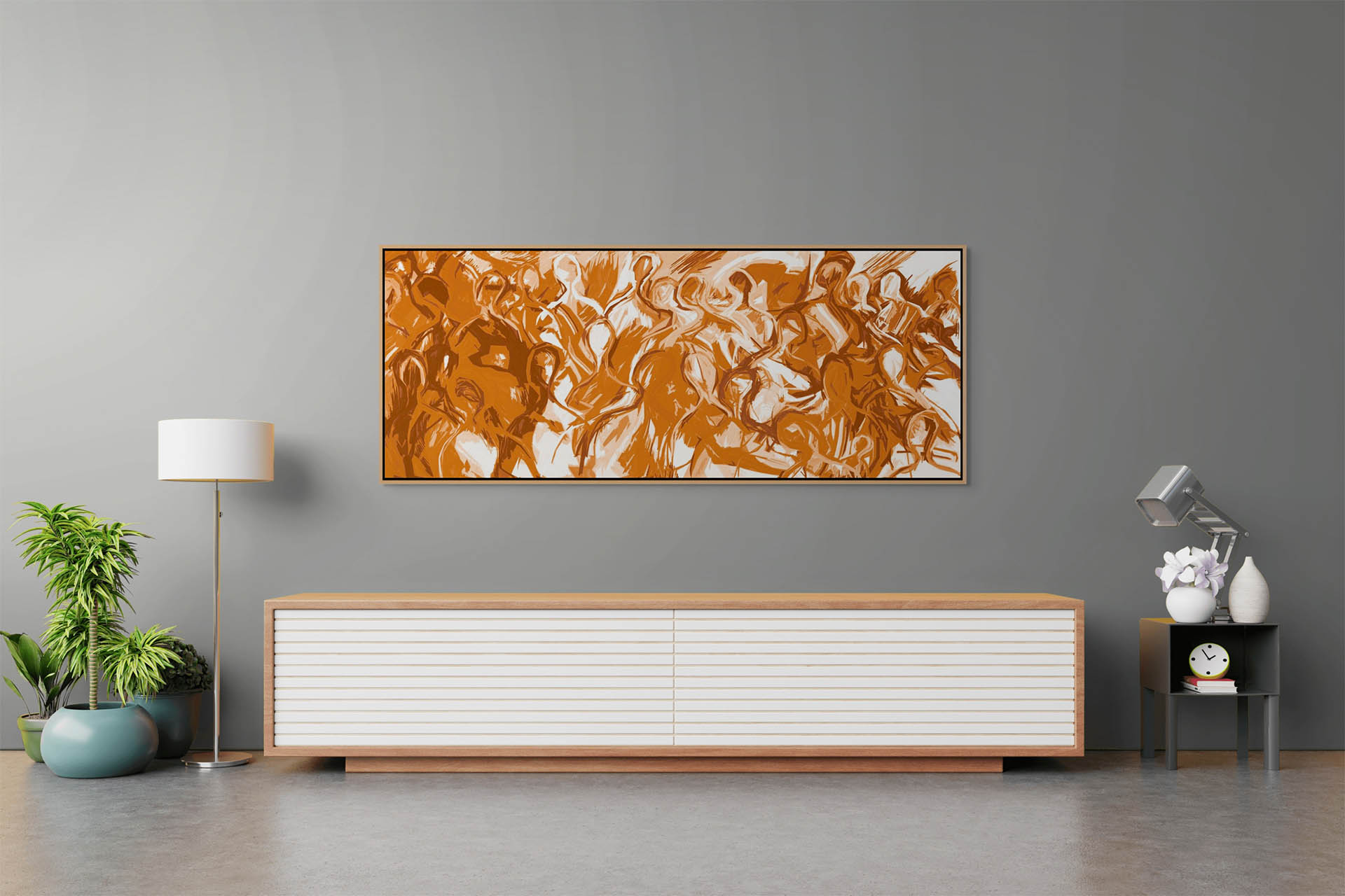A modern living room features We Are All Connected canvas art with brown and white swirls on a gray wall. Below, a low wooden sideboard with white drawers is accompanied by a potted plant and floor lamp, holding a small clock and book.
